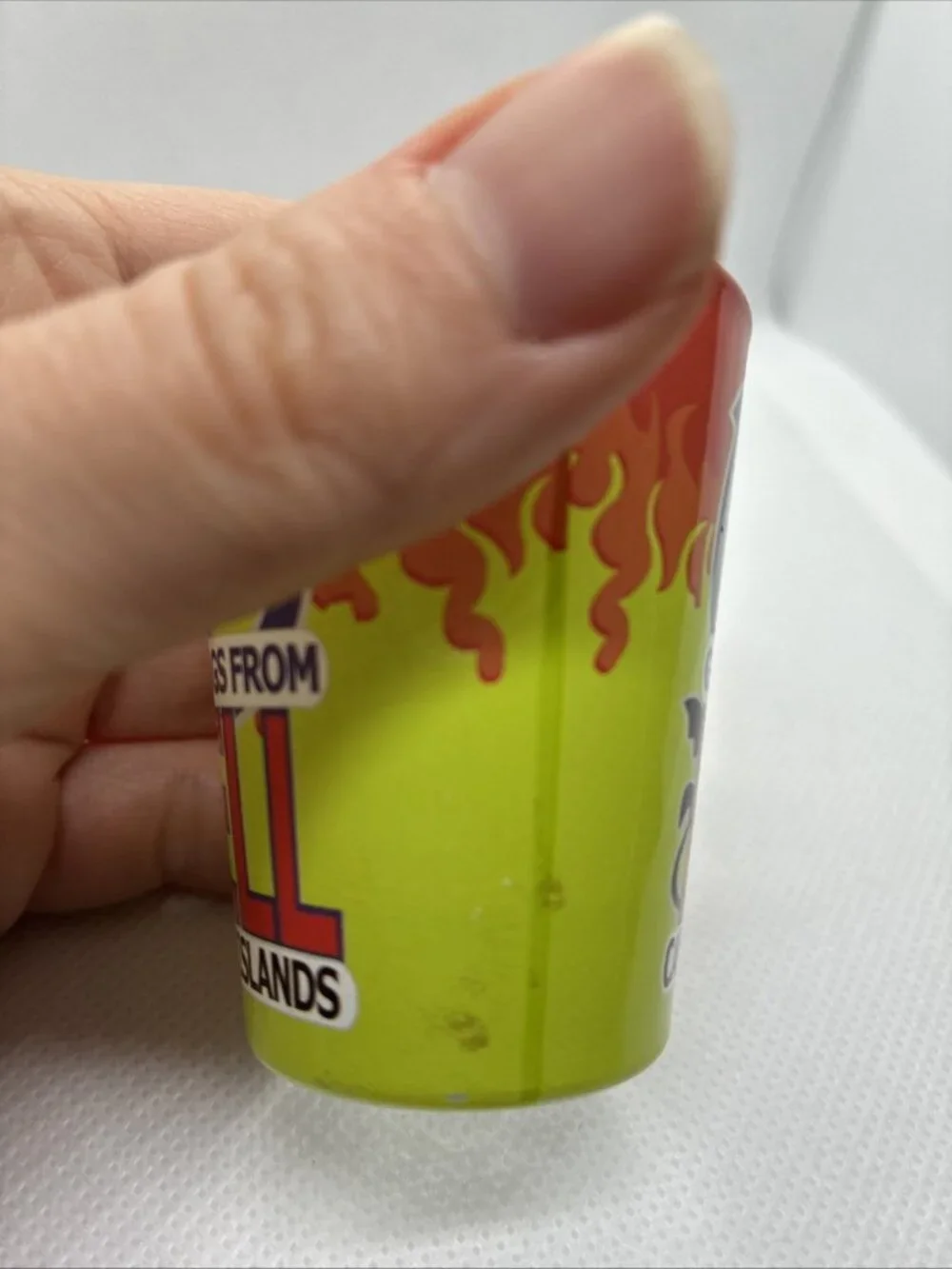 Vintage Greetings From Hell Cayman Islands Shot Glass Souvenir Red Green Flames